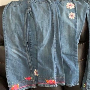 4 pairs of jeans and red pants for girls